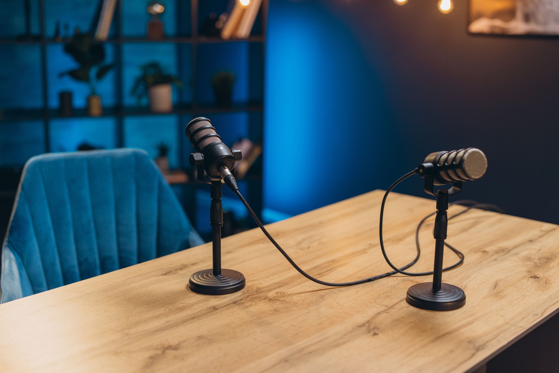 Two microphones are waiting for podcasters or speakers to start recording audio content in a professional studio